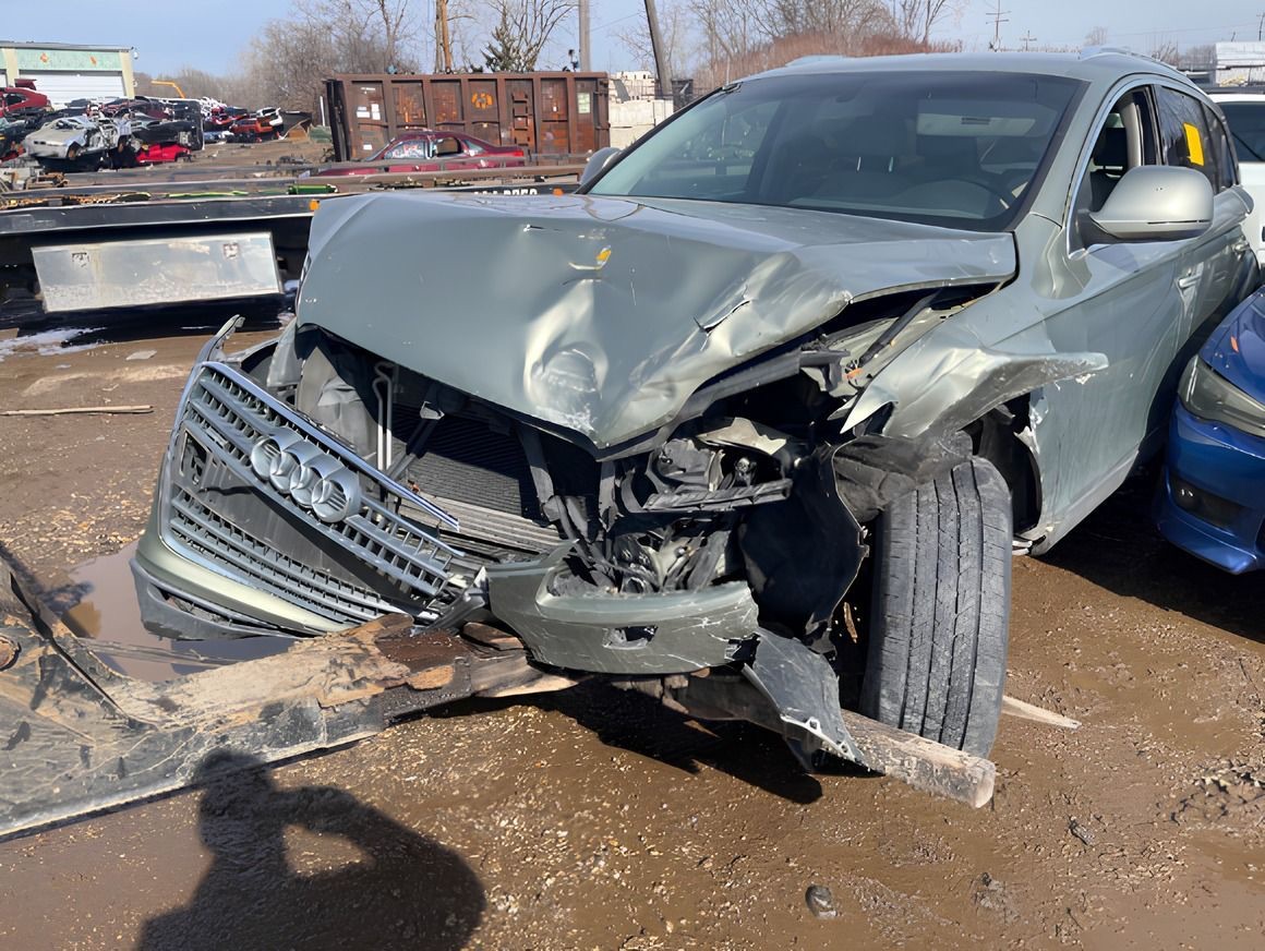 Front-end wrecked SUV KMK bought at a salvage yard